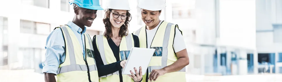 construction foreman showing her team the toolbox talk for the day